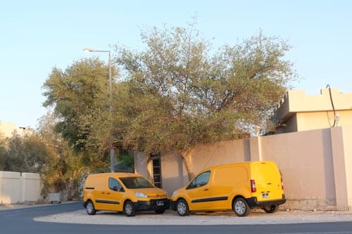 Courier vans parked on a residential street